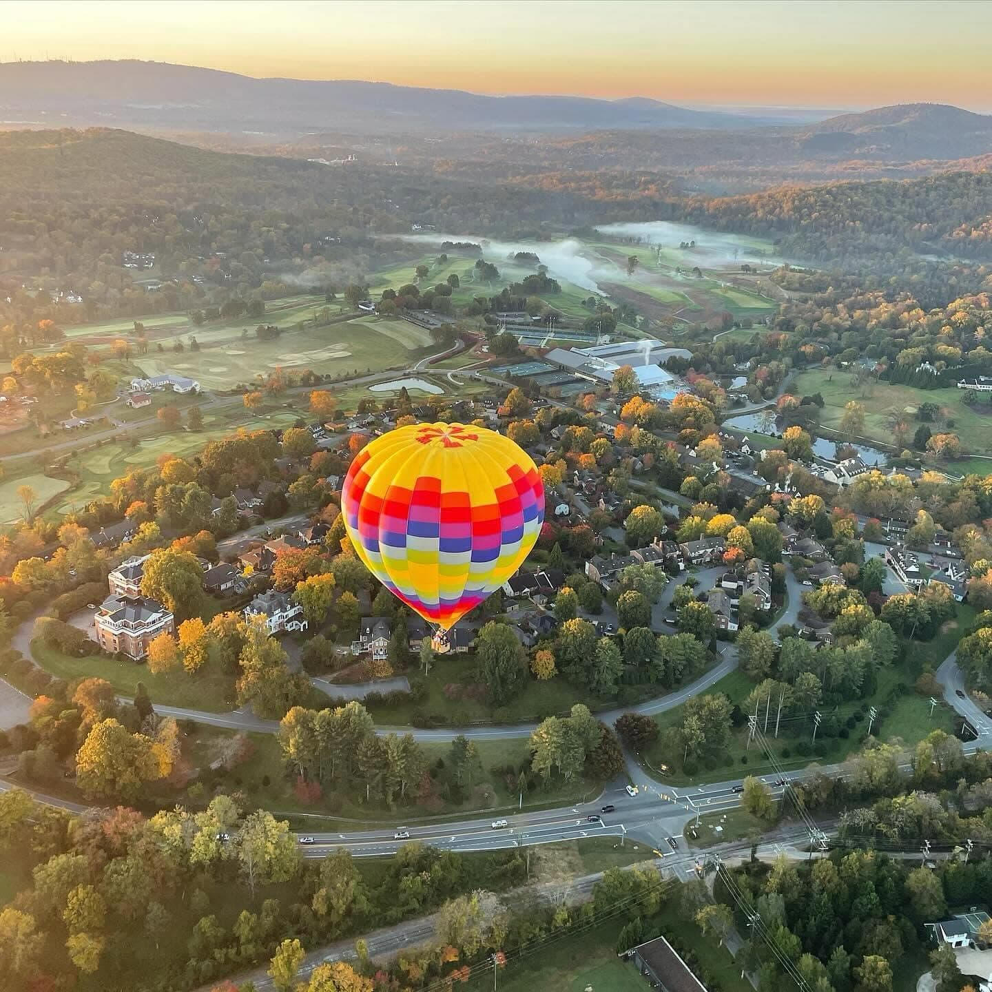 Aerial view of hot air balloon over Charlottesville fall foliage